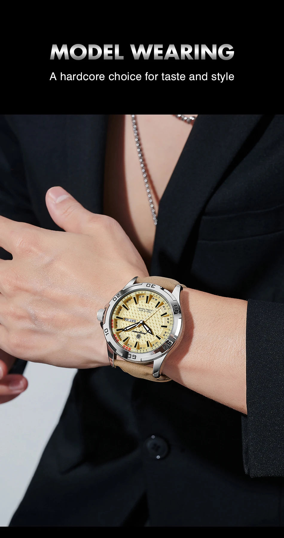 A close-up of a men's quartz watch with a gold-toned case and luminous dial worn on a wrist, paired with a black suit jacket.