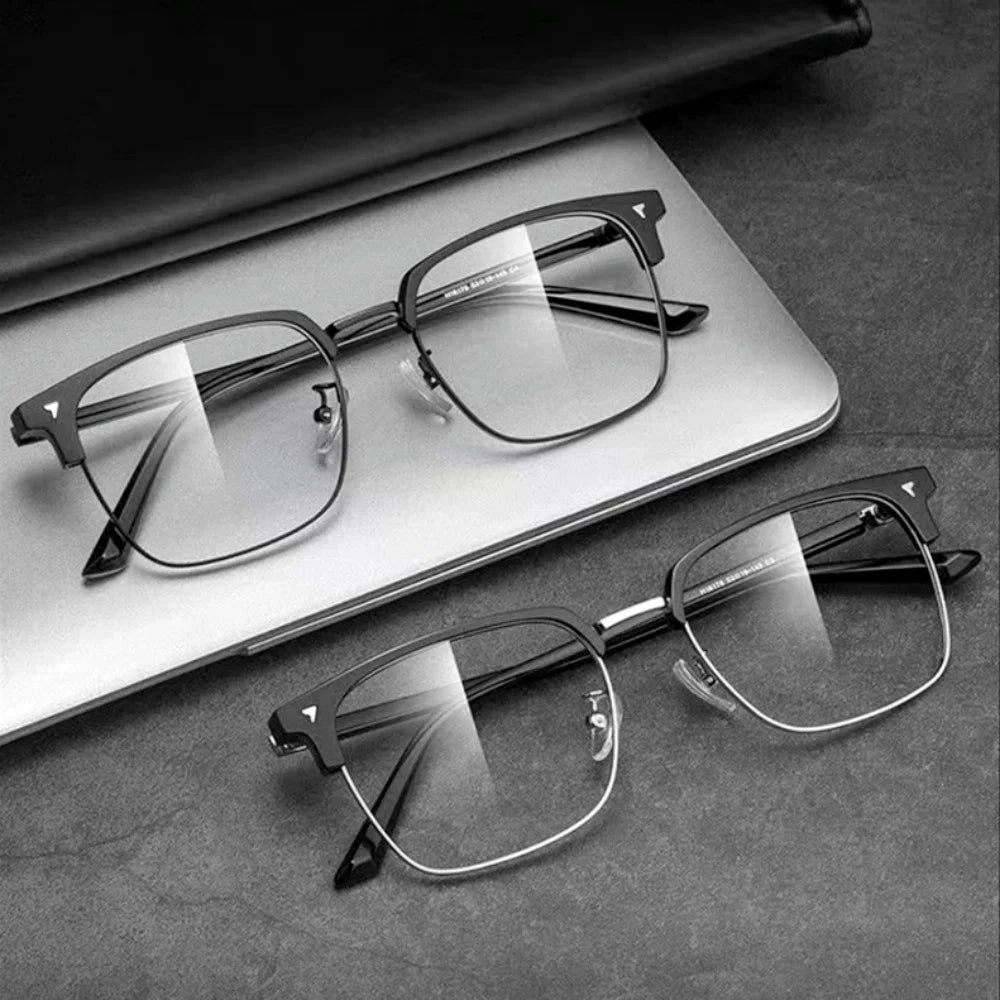 A pair of clear anti-blue light eyeglasses resting on a light-colored notebook or pad.