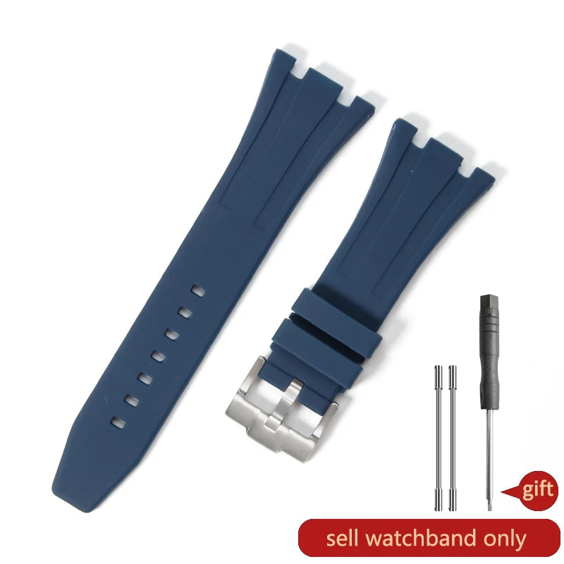 A dark blue silicone watch band with a quick-release buckle and a separate pin is shown.