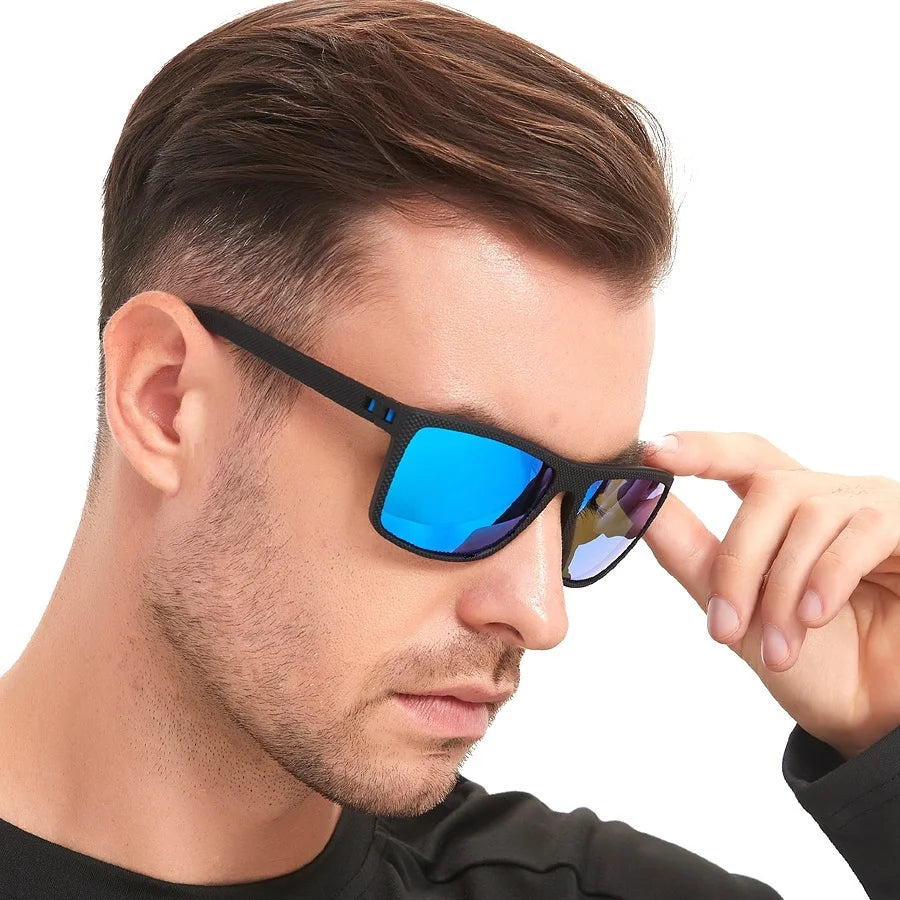 A man wearing vintage check pattern sunglasses with black frames and blue lenses.