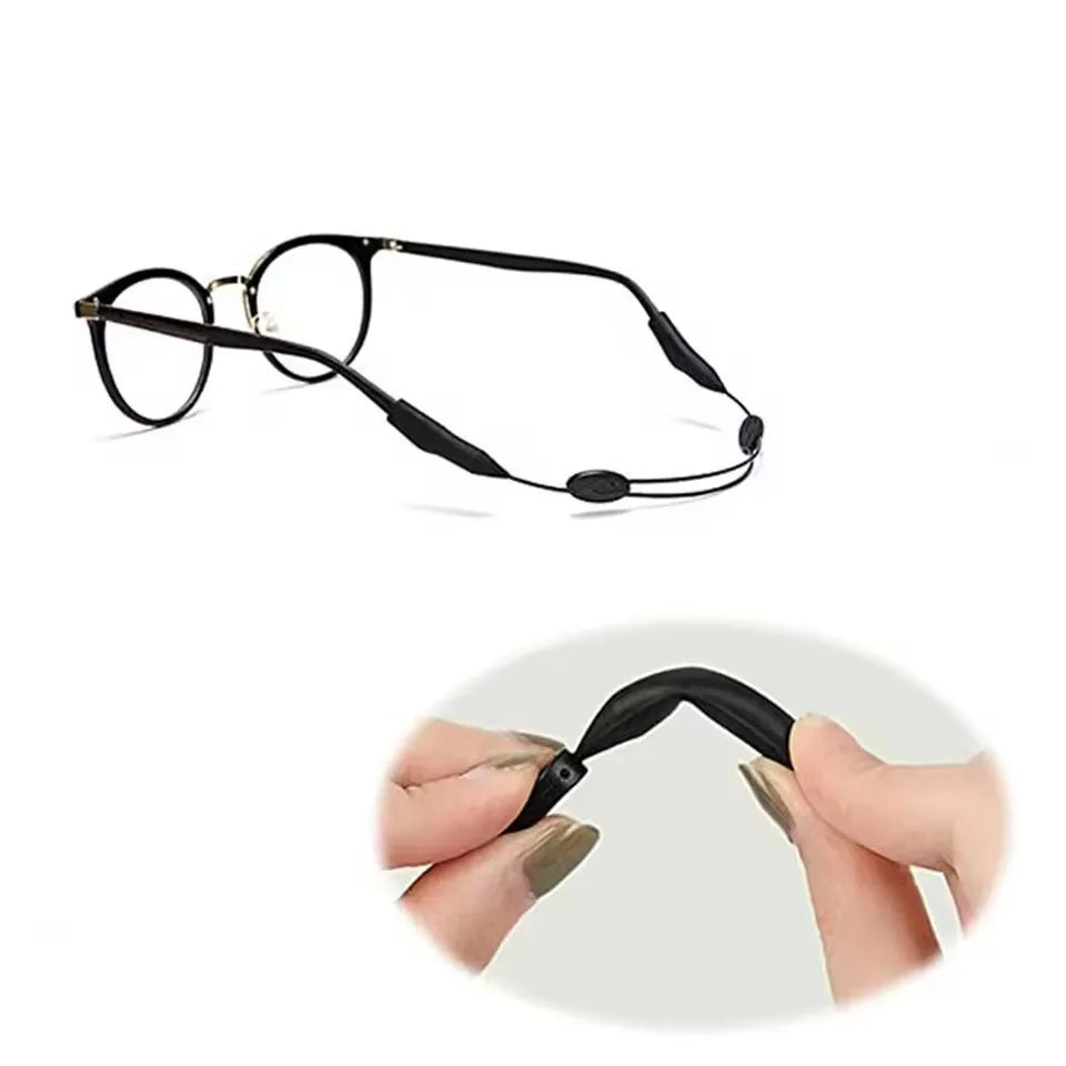 Un par de gafas negras ajustables de silicona con correa y cordón