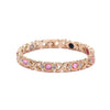 Gold-toned geometric bracelet featuring colorful gemstones like pink, blue, and black stones.