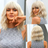 A close-up of a blonde woman modeling a short wavy bob wig in a gray tank top.
