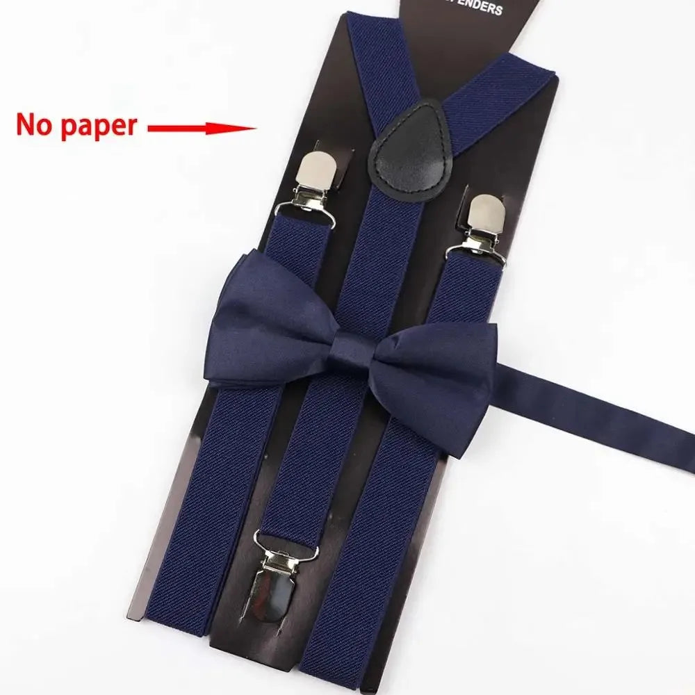 A set of adjustable navy blue polyester suspenders and bow ties with a black clip.