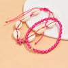 Pink beaded anklet featuring white conch shells and a starfish charm