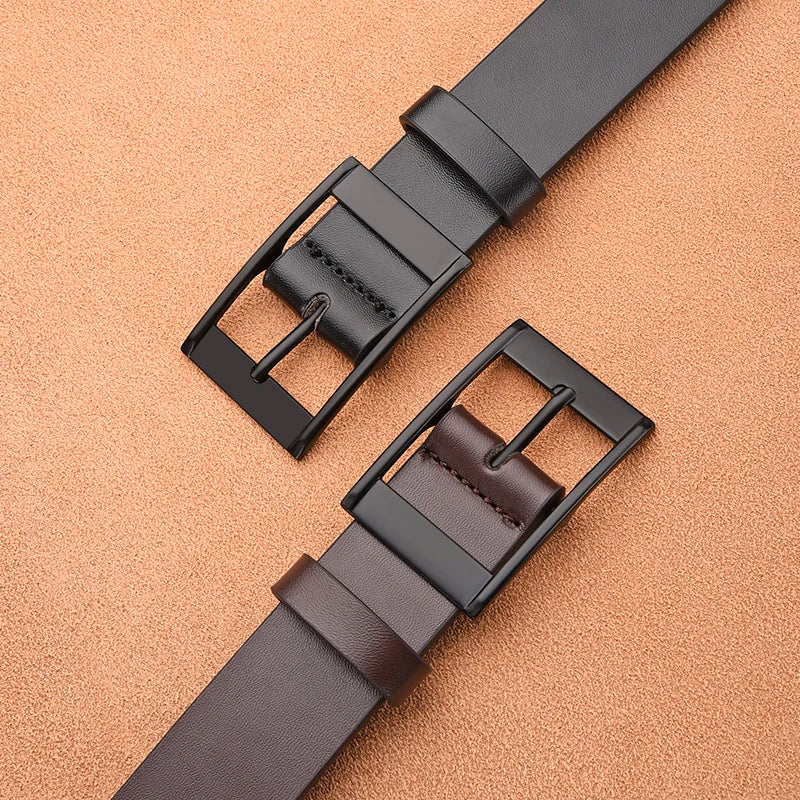 A dark brown men's luxury PU leather belt with a black metal pin buckle lying on a beige surface.