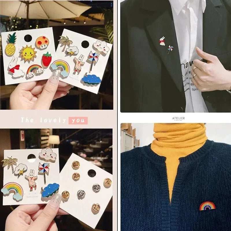 A collection of cute random fashion pins and badges on white cards, displayed by a hand.