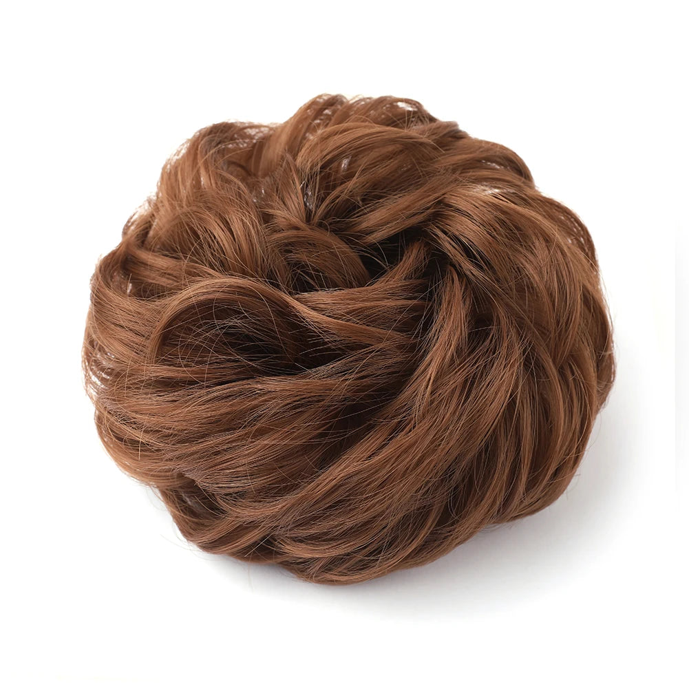 A close-up of a large messy bun hairstyle made from brown hair.