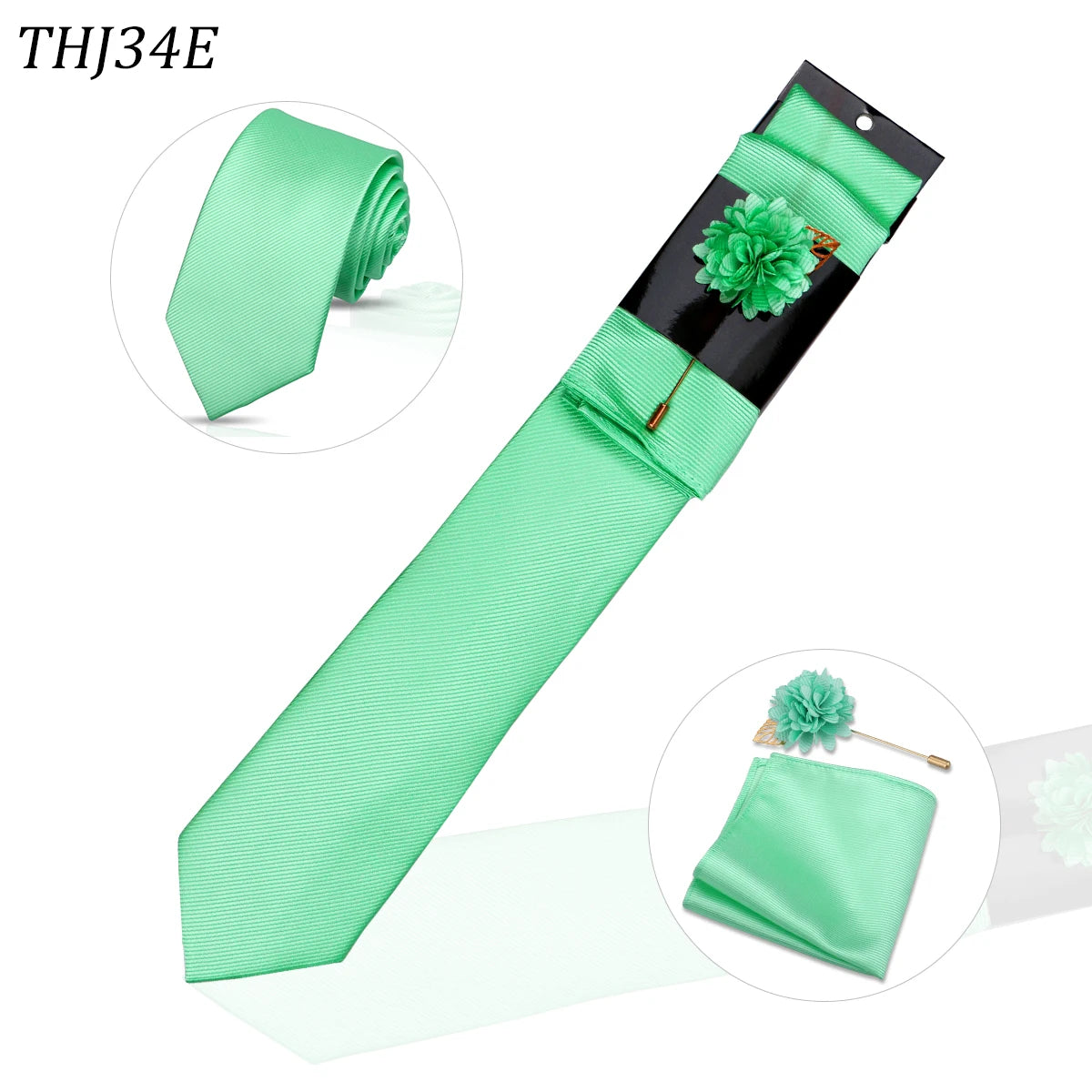 Conjunto de corbata de seda verde menta con pañuelo de bolsillo a juego y un broche floral verde decorativo.