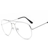 Lunettes avec monture or rétro et branches noires