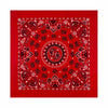 A red square fabric featuring intricate red and white paisley patterns.