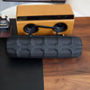 A wooden leather watch travel case organizer with black padded storage is displayed on a dark wood surface.