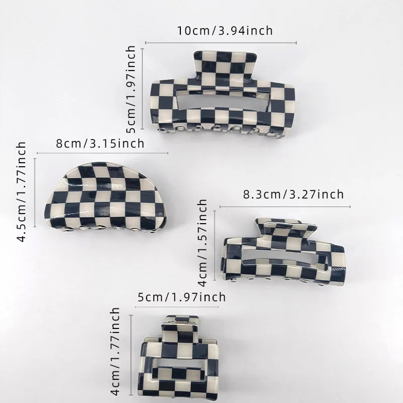 A collection of black and white checkered rectangle hair claw clips shown at various sizes.