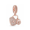 Rose gold cherry blossom charm pendant necklace with a textured link and a heart pendant