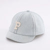A light gray denim baseball cap with a tan embroidered letter P