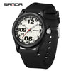A black classic quartz fashion watch with a white face and silver hands on a black silicone strap.