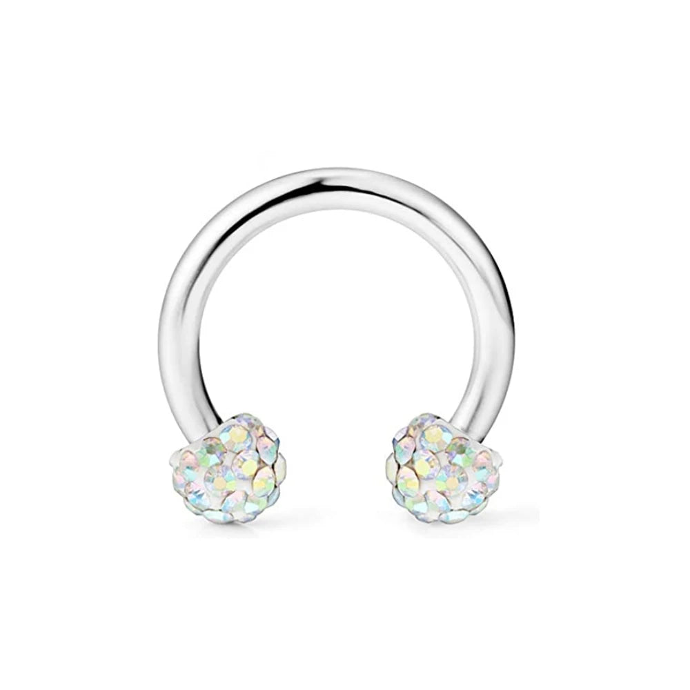 A set of crystal horseshoe barbell rings made of surgical steel.