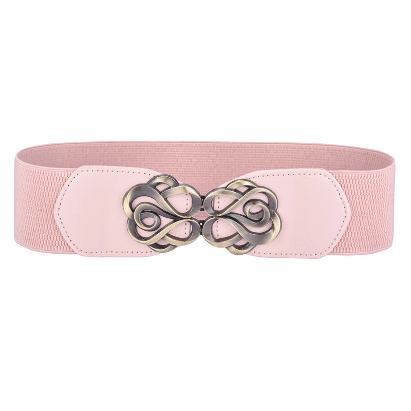A pink vintage leather elastic belt with a decorative brass twisted buckle.