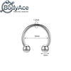 A silver titanium steel nose ring with a curved hoop and spherical balls.