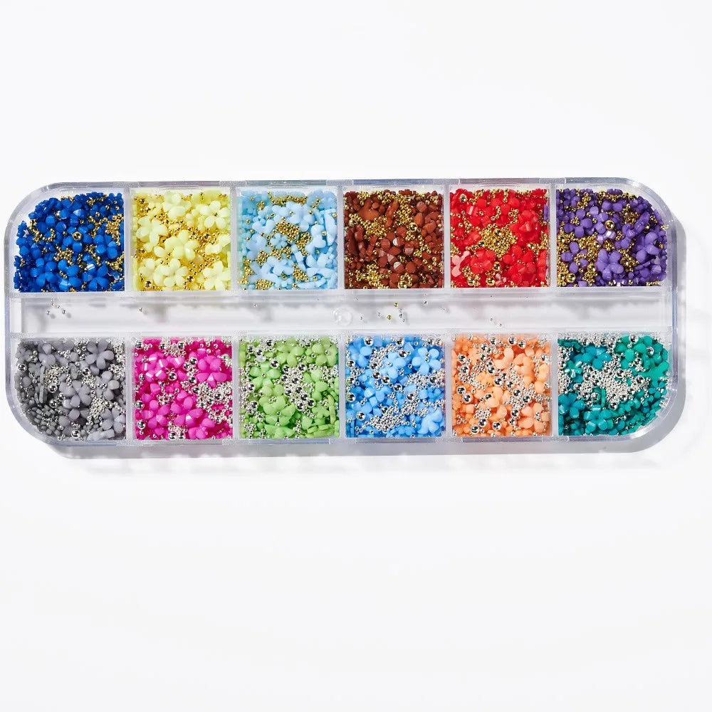 A collection of pink and white butterfly bow nail charms in various colors and glitter shades.