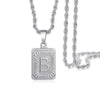 A silver letter B pendant necklace with a chain, featuring an engraved design.