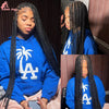 A woman modeling a 36 inch full lace box braids wig in a blue hoodie.