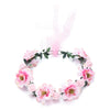A floral wreath made of pink and white roses used as a bohemian flower headband for women.