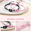 Two adjustable pink and black knot bracelets displayed on a white plate.