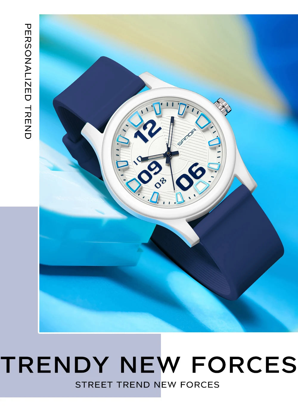 A white and blue analog watch with a dark blue silicone strap is shown on a light blue surface.