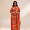 A woman models an orange and blue patterned long silk blend cover-up robe dress.