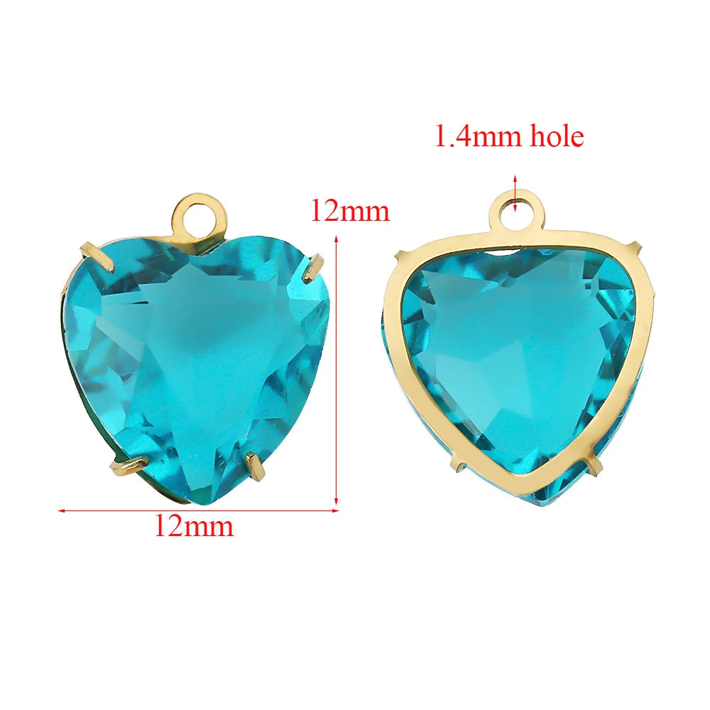 A pair of turquoise heart-shaped crystal pendants with 1.4mm holes and gold-colored findings.