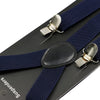 A set of adjustable polyester suspenders and bow ties featuring dark blue straps and silver clips on a black background.