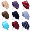 A collection of eight elegant men's silk neckties in various colors and patterns including striped, floral, paisley, polka do