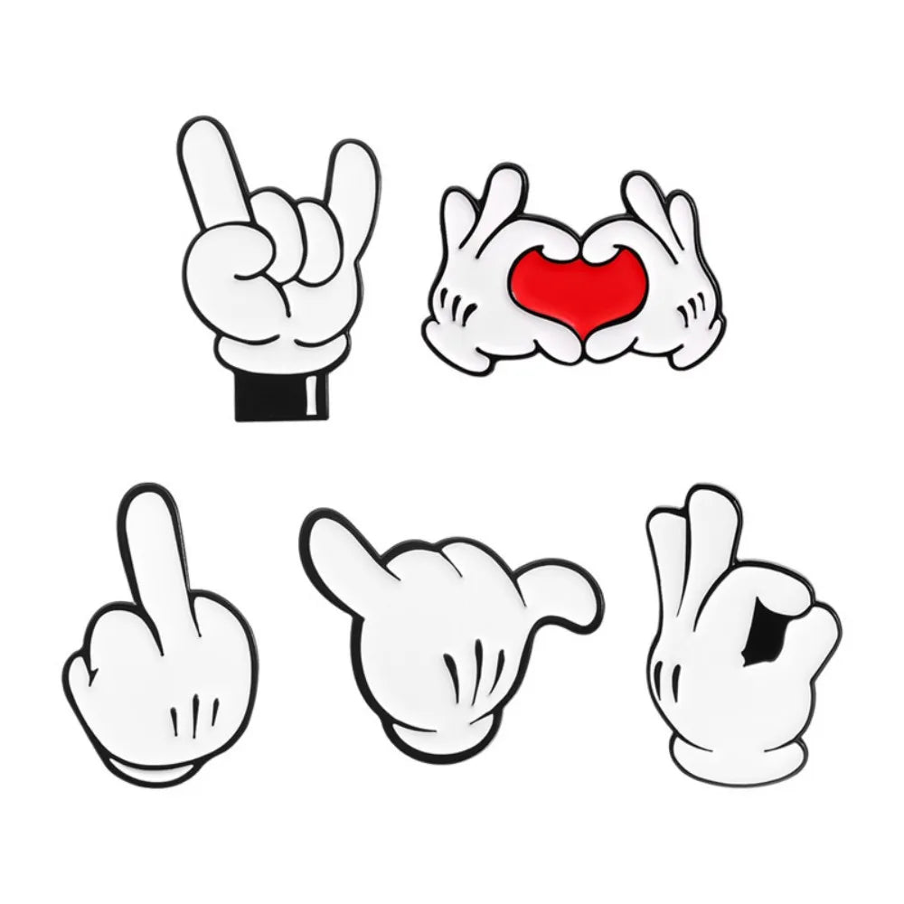 A set of enamel pins featuring various cartoon finger gestures, including a rock sign and a heart hand.