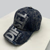 A dark denim baseball cap embroidered with the letters DISFL and the word shionbrand