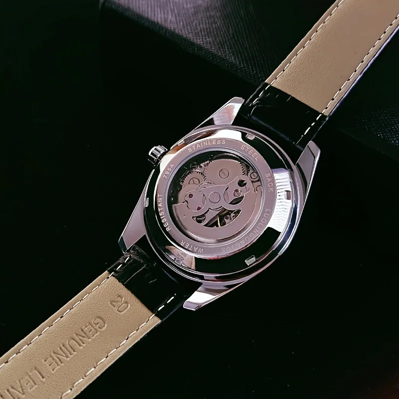 A close-up of a stainless steel luxury automatic mechanical men's wristwatch with a black strap and silver accents.
