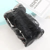 A black, crinkled hair rope product is displayed on a white surface next to packaging.