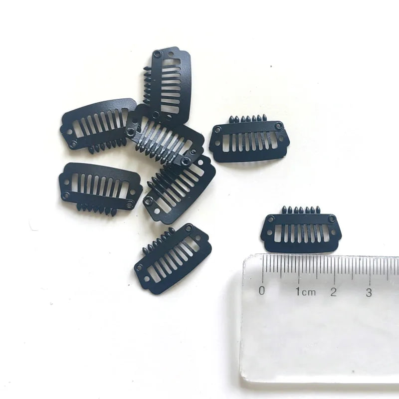 A set of black precision hair extension clips with various sizes and shapes displayed on a white background.