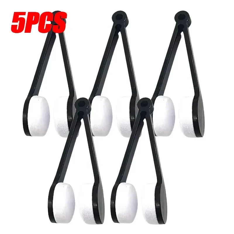 A set of five black and white portable multifunctional eyeglass cleaning tools with hinged arms.