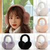 A collection of plush fur ear warmers and earmuffs in various shades including pink, beige, purple, and black.