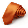 A folded orange satin neck tie for formal wear.