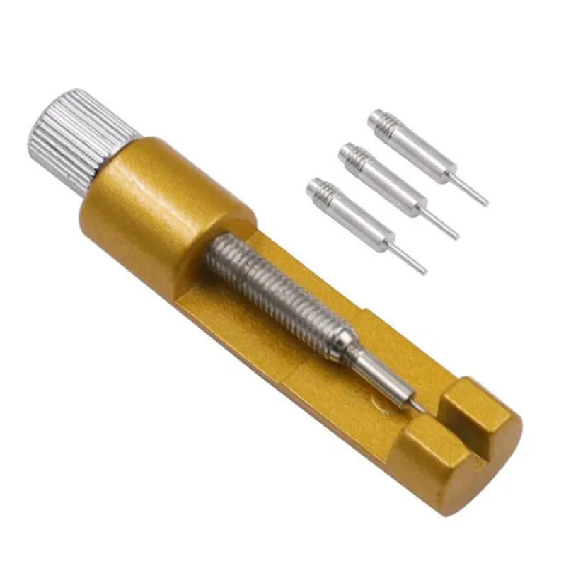 A brass precision metal watch strap adjuster tool with multiple adjustment pins.