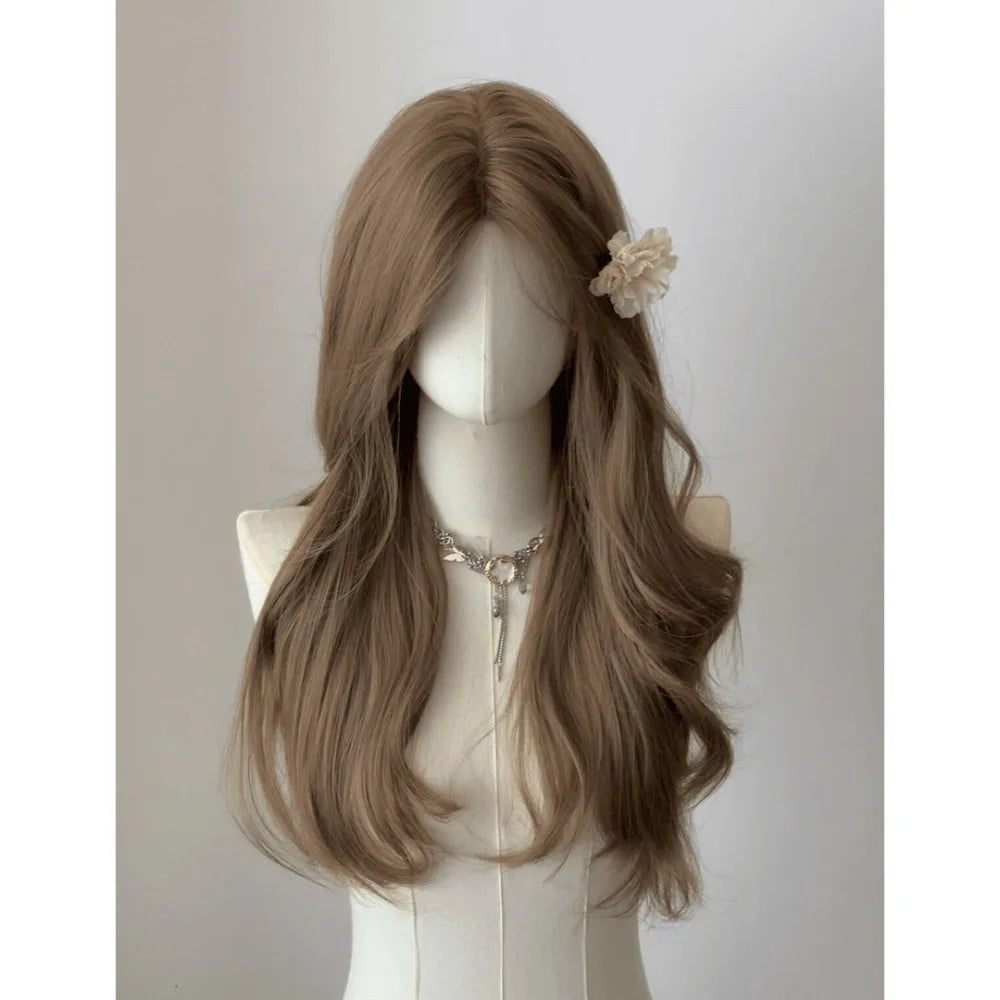 A long, wavy brown wig displayed on a mannequin with a floral accessory.
