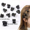 A set of black adjustable hair claw clips shown with various sizes and angles against a white background.