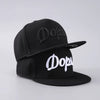 Black luxury baseball cap with white embroidered text on the front