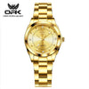 A gold-toned quartz watch with a metal bracelet and a round face is shown against a white background.