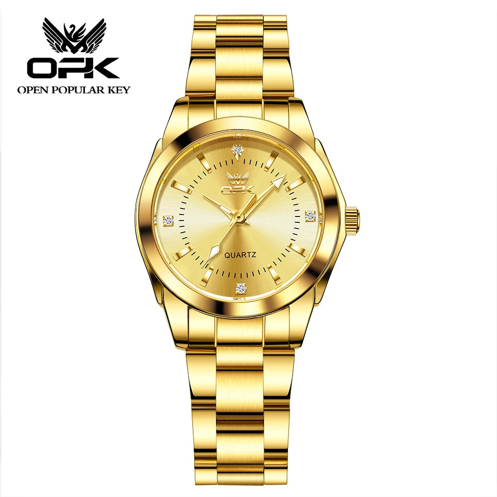 A gold-toned quartz watch with a metal bracelet and a round face is shown against a white background.