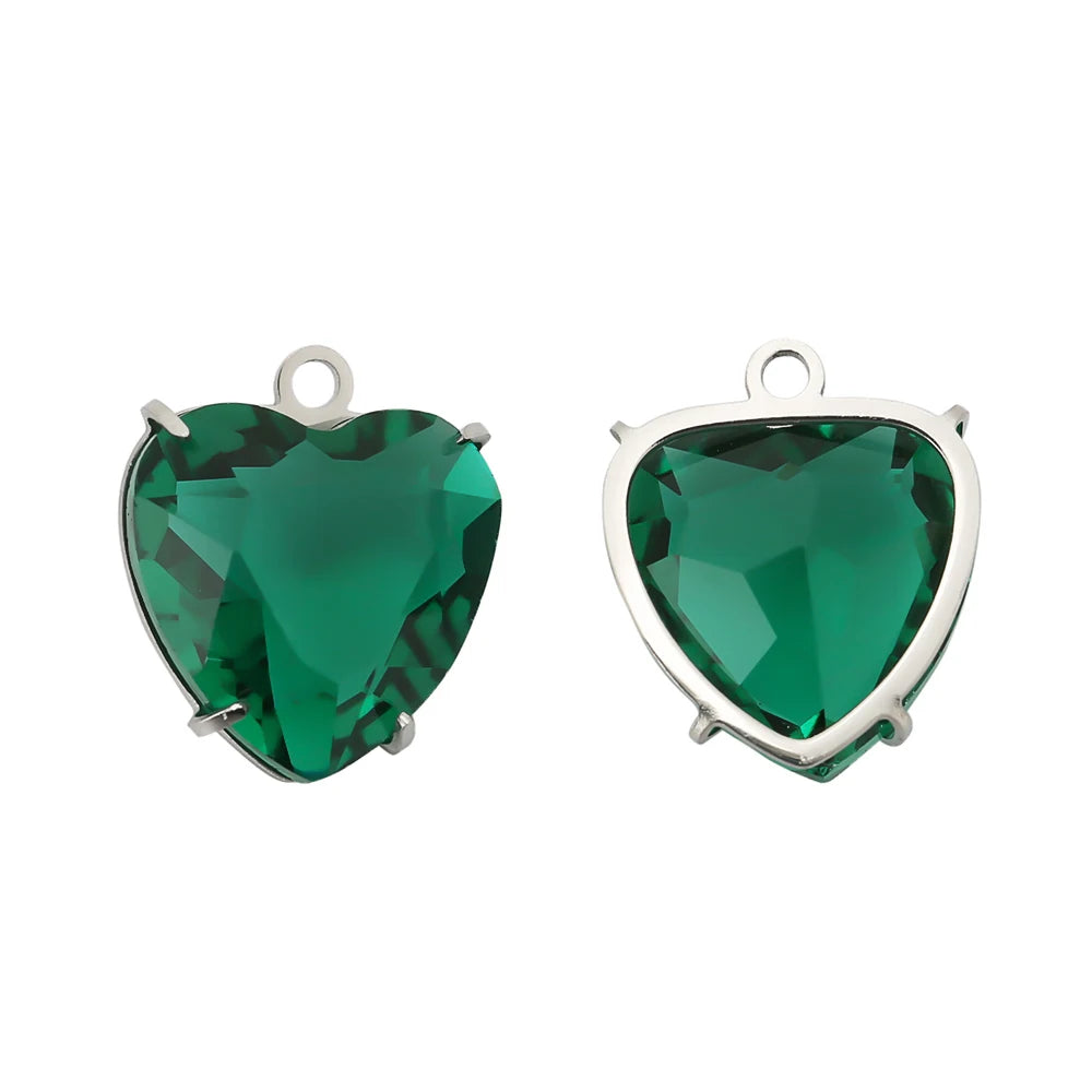 A pair of heart-shaped green crystal pendants set in stainless steel.