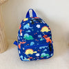 A blue kids backpack featuring a cute dinosaur and unicorn pattern, resting on a white surface.