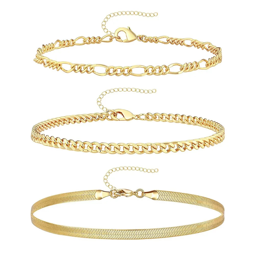 A set of three gold-colored waterproof stainless steel anklets for women displayed against a white background.